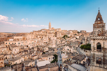 Fototapeta na wymiar Wide view of the Sassi di Matera from the Belvedere di San Pietro Barisano, blue sky with clouds