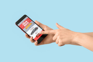 Woman ordering rental car on blue background