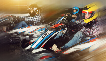 active happy people driving sport cars for karting in a circuit lap in sport club © JackF