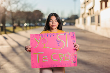feminist movement for womens day 8 march. ecuador latin woman with spanish banner yo si te creo