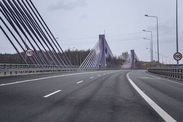 Fototapeta na wymiar View from car on a road bridge in Mszana village on A1 highway in Poland