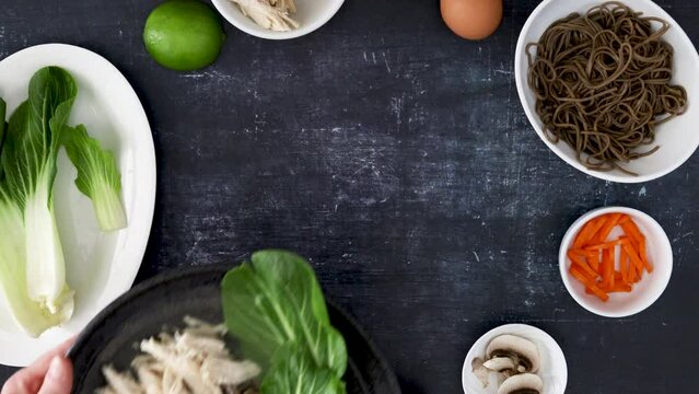 Serving a Bowl of Soba Noodles with Vegetables