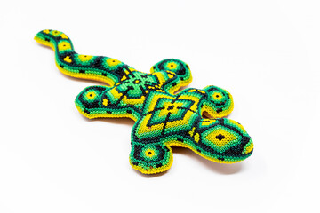 Beautiful huichol tradition pattern crafted lizard