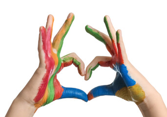 Child making heart shape with hands in paint on white background