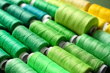 Spools with green threads, closeup