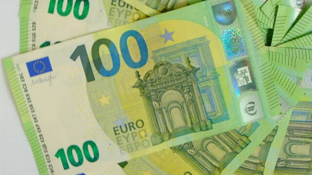 100 euro background. Banknotes one hundred euros set on a white background.Currency of the European Union. 4k footage