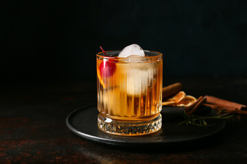 Glass of delicious Old Fashioned Cocktail on black background