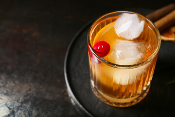 Glass of delicious Old Fashioned Cocktail on black background