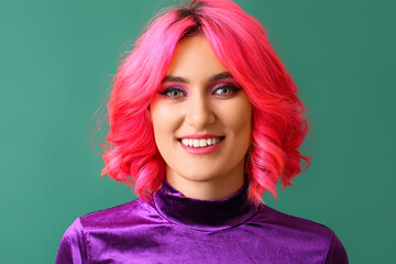 Stylish woman with bright hair on color background