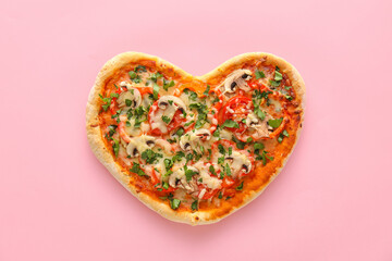 Tasty heart-shaped pizza on pink background. Valentine's Day celebration