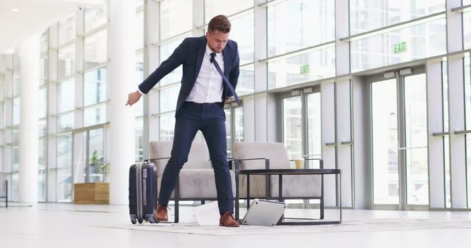 Slow internet is enough to let me lose my cool. Angry businessman throwing a laptop in a convention centre, airport or office. Stressed caucasian man getting mad, frustrated and upset at broken tech