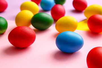 Multicolored Easter eggs on color background