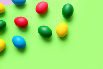 Multicolored Easter eggs on color background