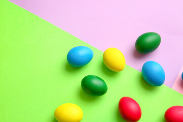 Multicolored Easter eggs on color background