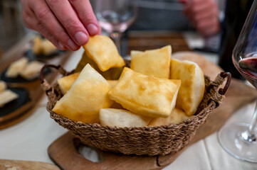 Food of Emilia Romagna region, deep fried bread gnocco fritto or crescentina served in restaurant...