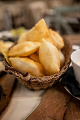 Food of Emilia Romagna region, deep fried bread gnocco fritto or crescentina served in restaurant in Parma, Italy