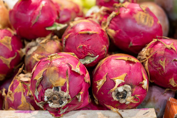 Fresh pink tropical dragon fruits on sale at market, exotic fruits