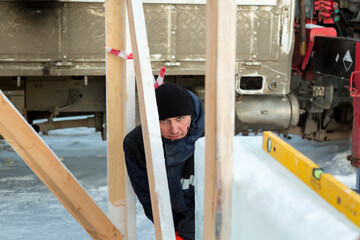 Portrait of an installer working with a level