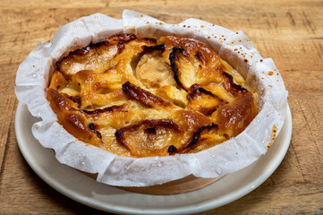 Baked apple cake with almond frangipani custard close up