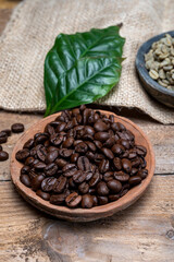Green un-roasted and brown roasted coffee beans from Africa coffee producing region, cultivating in Ethiopia, Ivory Coast, Uganda, Kenya, Rwanda and Tanzania
