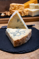 British cheeses collection, blue Stilton, Scottish coloured and English matured cheddar cheeses