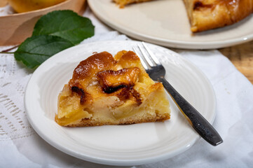 Baked apple cake with almond frangipani custard close up
