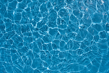 Shining blue water ripple background. Summer concept.