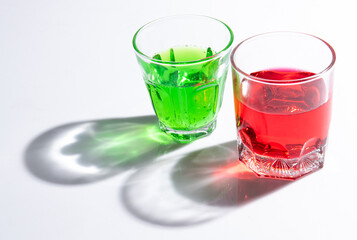 Shadow of soda water in glass with liquid,sunshine through