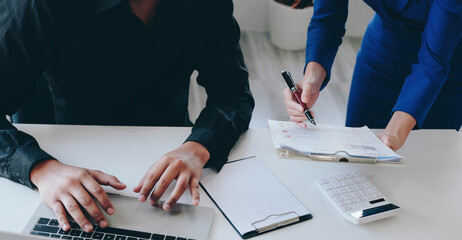 Financial report data of business operations (balance sheet and income statement and diagram) as Fintech concept.Business team meeting. digital tablet and computer laptop.