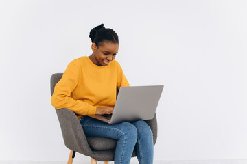 Happy Black Woman Working With Laptop At Home, Positive Young African American Freelancer Lady Using PC Computer