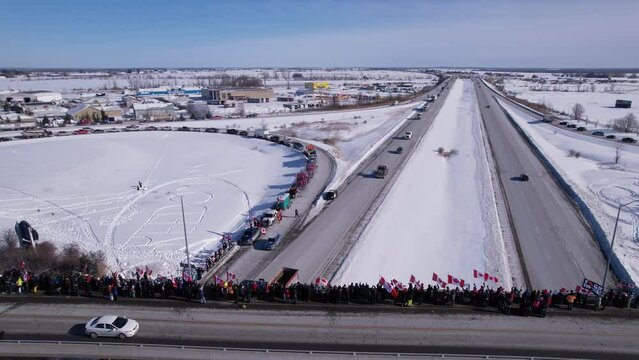 Freedom Rally 2022 drives past supporters protesting the vaccine mandates in Casselman, Ontario on their way to Ottawa.