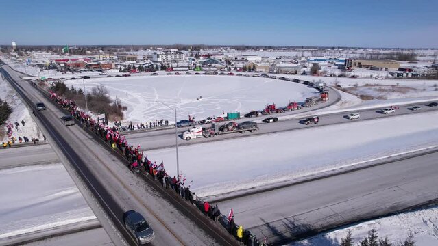 Freedom Rally 2022 drives past supporters protesting the vaccine mandates in Casselman, Ontario on their way to Ottawa.