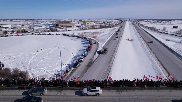 Freedom Rally 2022 drives past supporters protesting the vaccine mandates in Casselman, Ontario on their way to Ottawa.