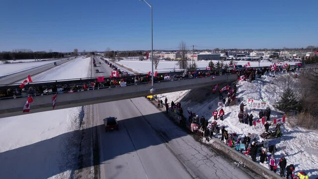 Freedom Rally 2022 drives past supporters protesting the vaccine mandates in Casselman, Ontario on their way to Ottawa.