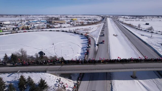 Freedom Rally 2022 drives past supporters protesting the vaccine mandates in Casselman, Ontario on their way to Ottawa.
