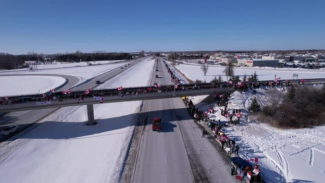 Freedom Rally 2022 drives past supporters protesting the vaccine mandates in Casselman, Ontario on their way to Ottawa.