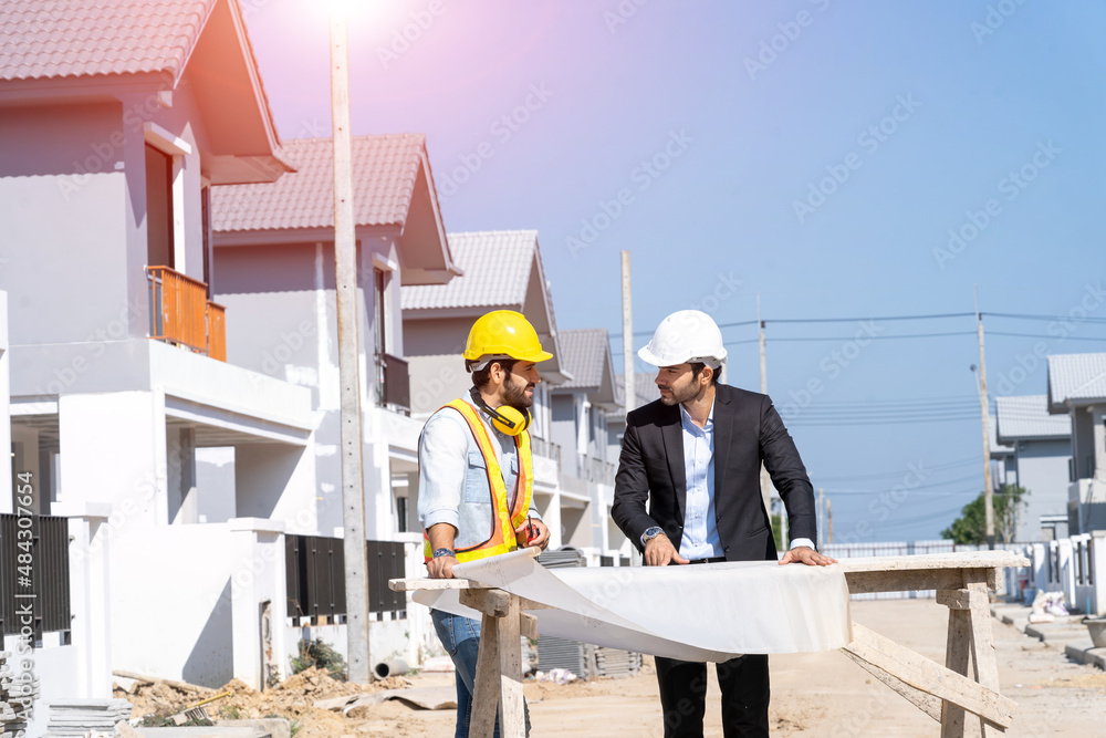 Aufkleber structural engineer and foreman worker with blueprint discuss plan working for the new house constru