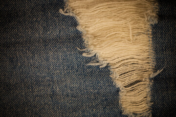 Torn denim vintage background.