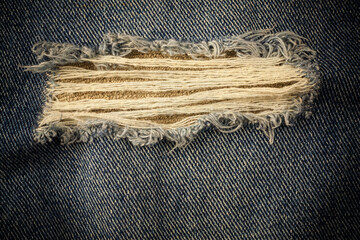 Vintage torn denim background.