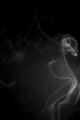 White smoke on black background.