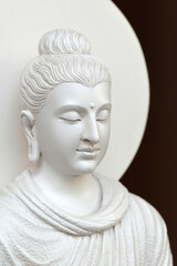 beautiful face of white stone buddha