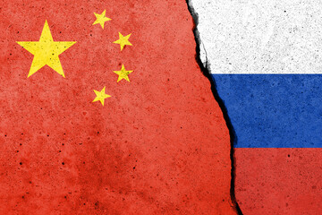 Flags of China and Russia painted on the concrete wall