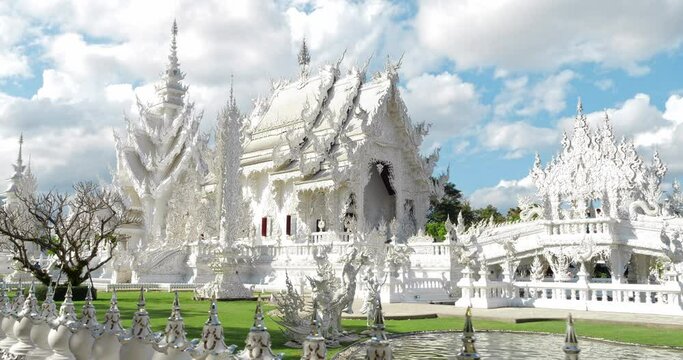 Chiang Rai, Thailand, January 2022. White Temple (Wat Rong Khun) is one of the most famous attractions of Northern Thailand, Amazing Thailand travel concept.
