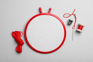 Flat lay composition with embroidery hoop on light grey background © New Africa
