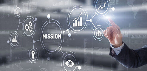 Businessman clicks on virtual screen Mission