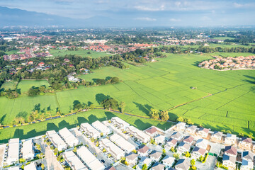 Land or landscape of green field in aerial view. Include agriculture farm, house building, village. That real estate or property. Plot of land to sale, rent, buy mortgage or investment in Chiang Mai.