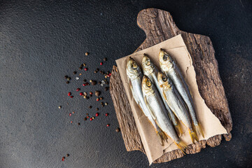 smoked sprat fish herring salted seafood meal food snack on the table copy space food background 