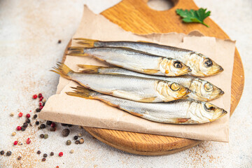 smoked sprat fish herring salted seafood meal food snack on the table copy space food background 