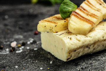 grilled slices of halloumi cheese with grill marks and mint. Cyprus squeaky cheese. Food recipe...