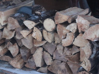 Dried logs stacked on the street